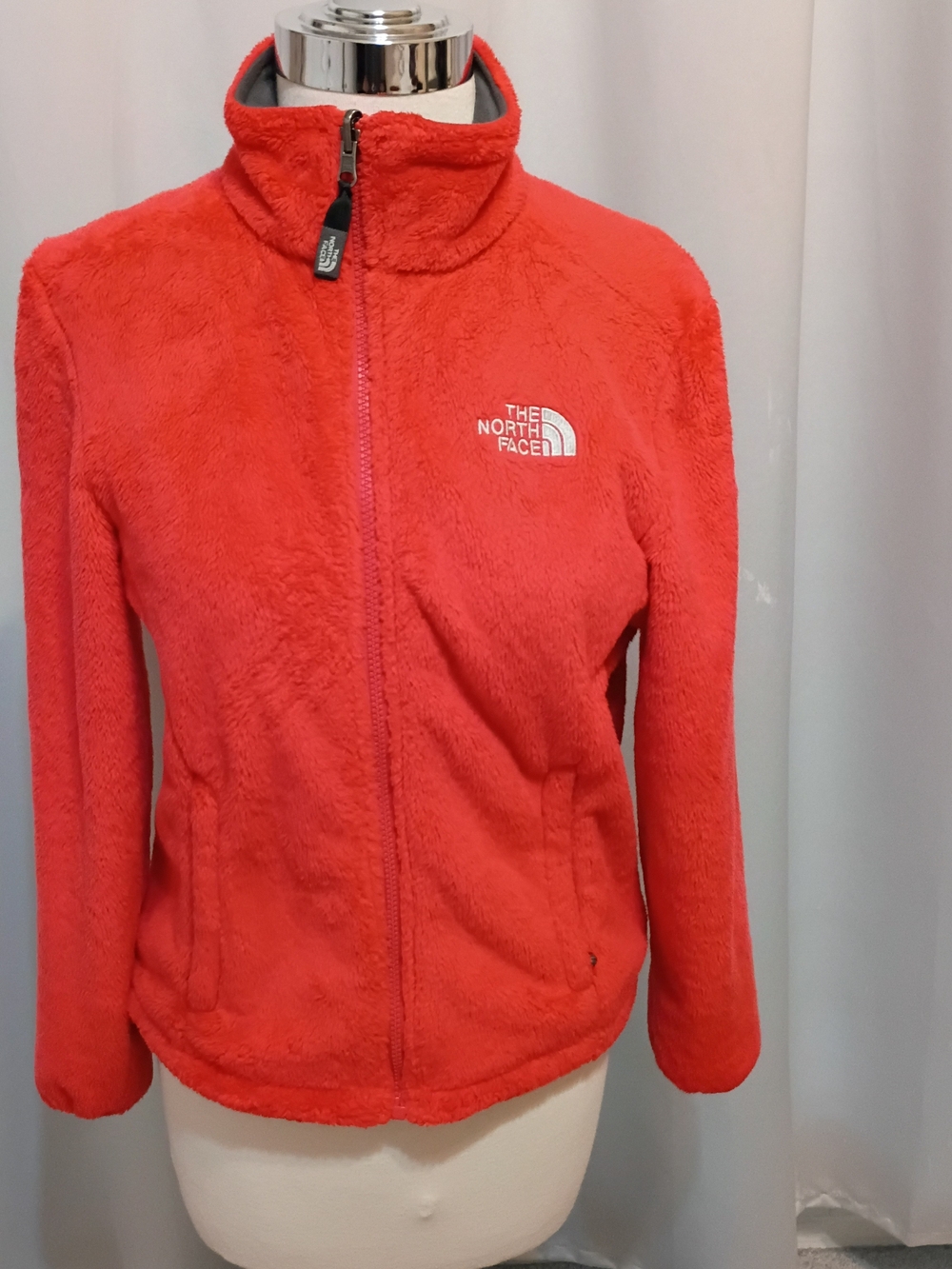 The North Face Red Fleece Jacket with Black Trim and Logo Tag